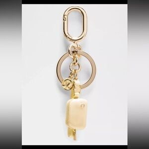 Lululemon Athletica Gold and Cream Key Holder